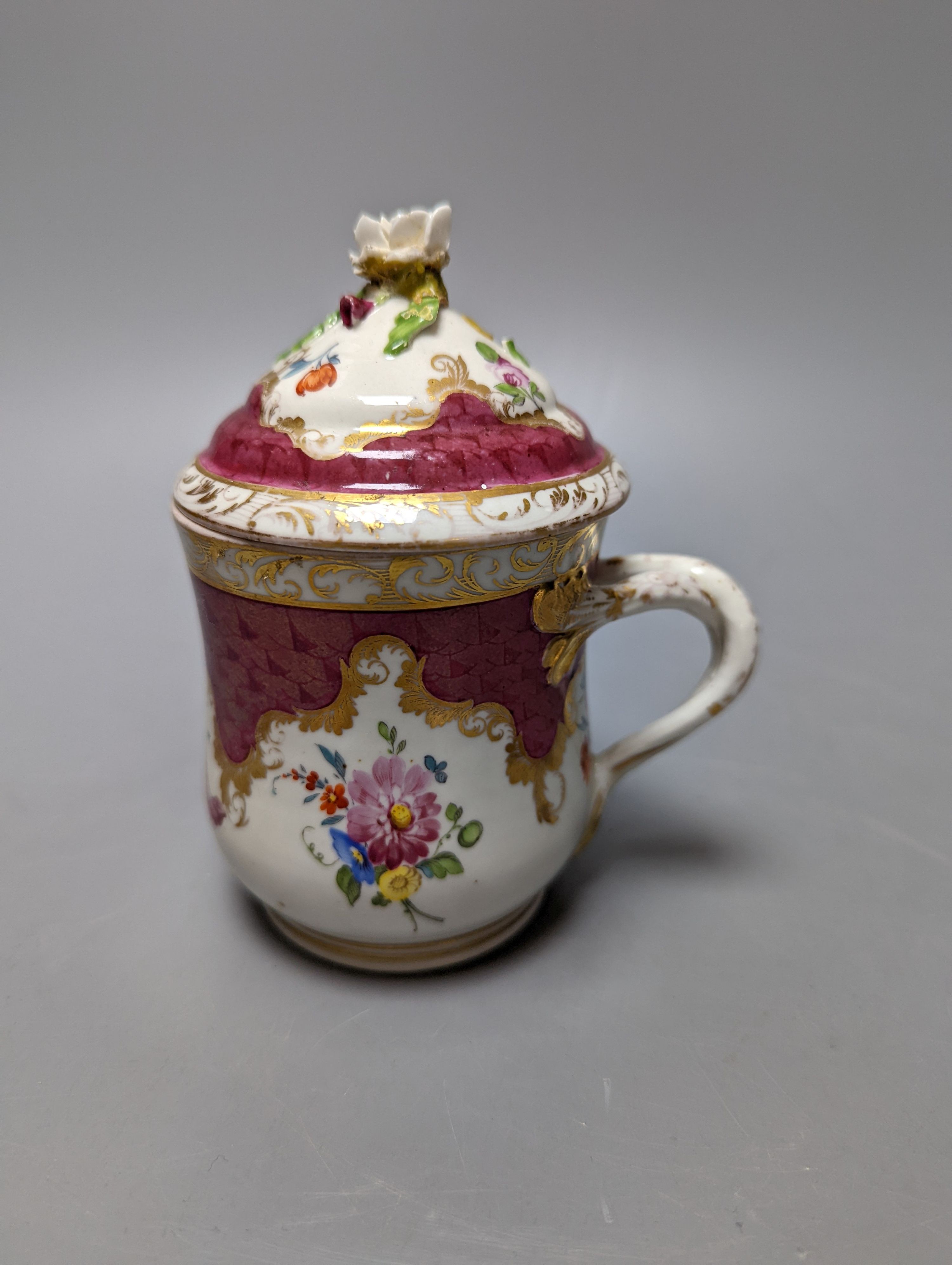 A Meissen style chocolate cup and cover, two mid 19th century English porcelain flower encrusted pots and covers and two dishes